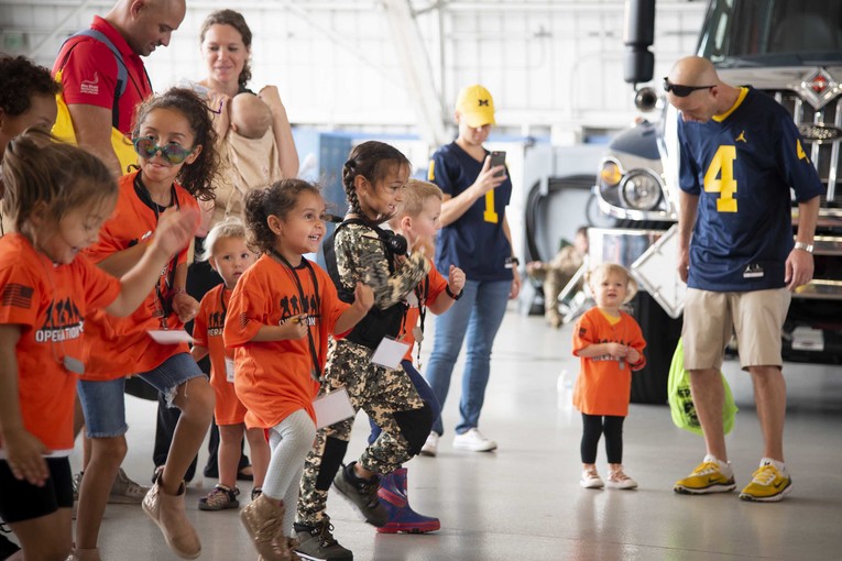 A group of children stop their feet.